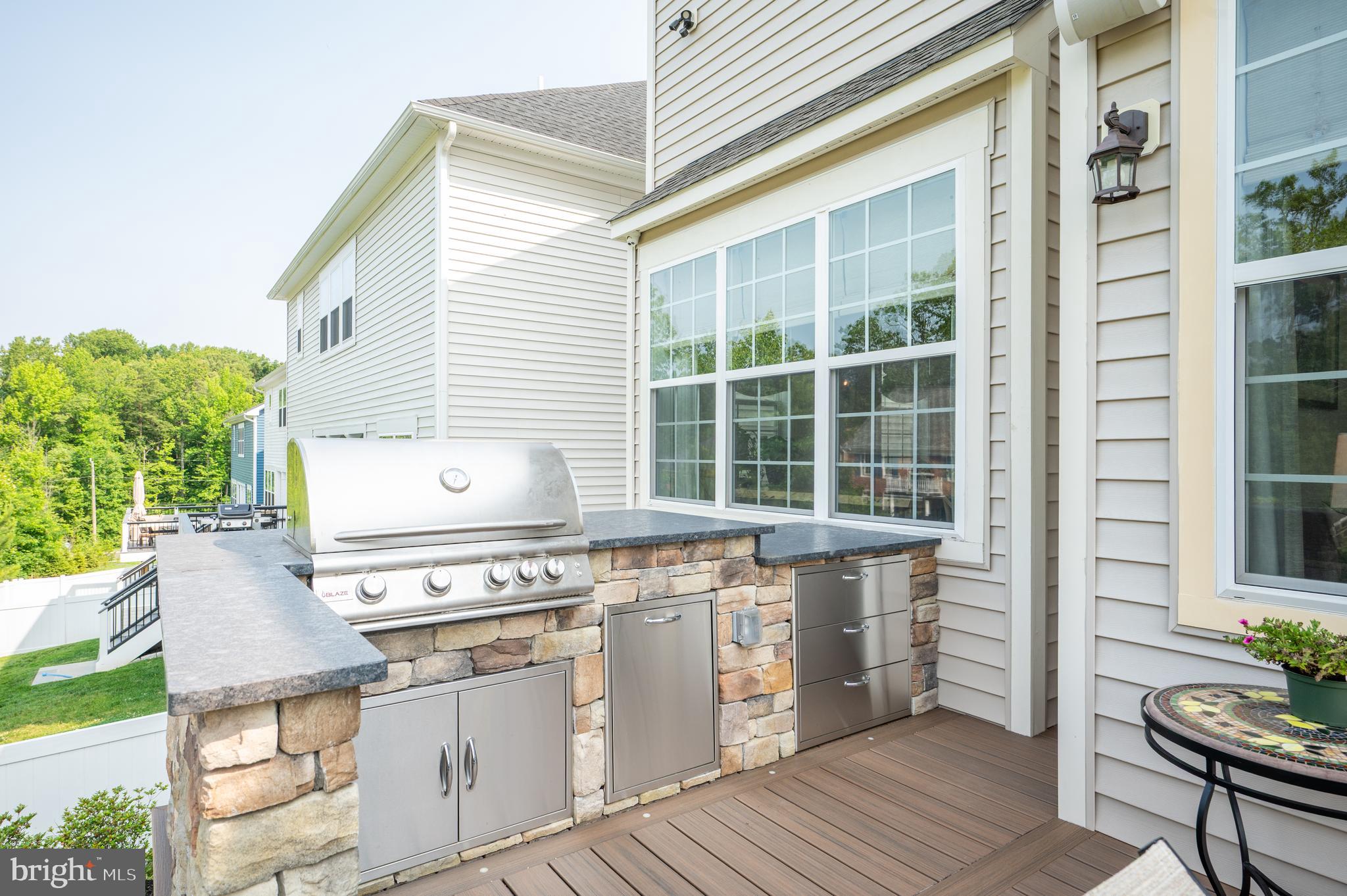6233 McConnell Lane Springfield, VA 22152 - Photo 6 of 58 a kitchen with a stove and a wooden cabinets