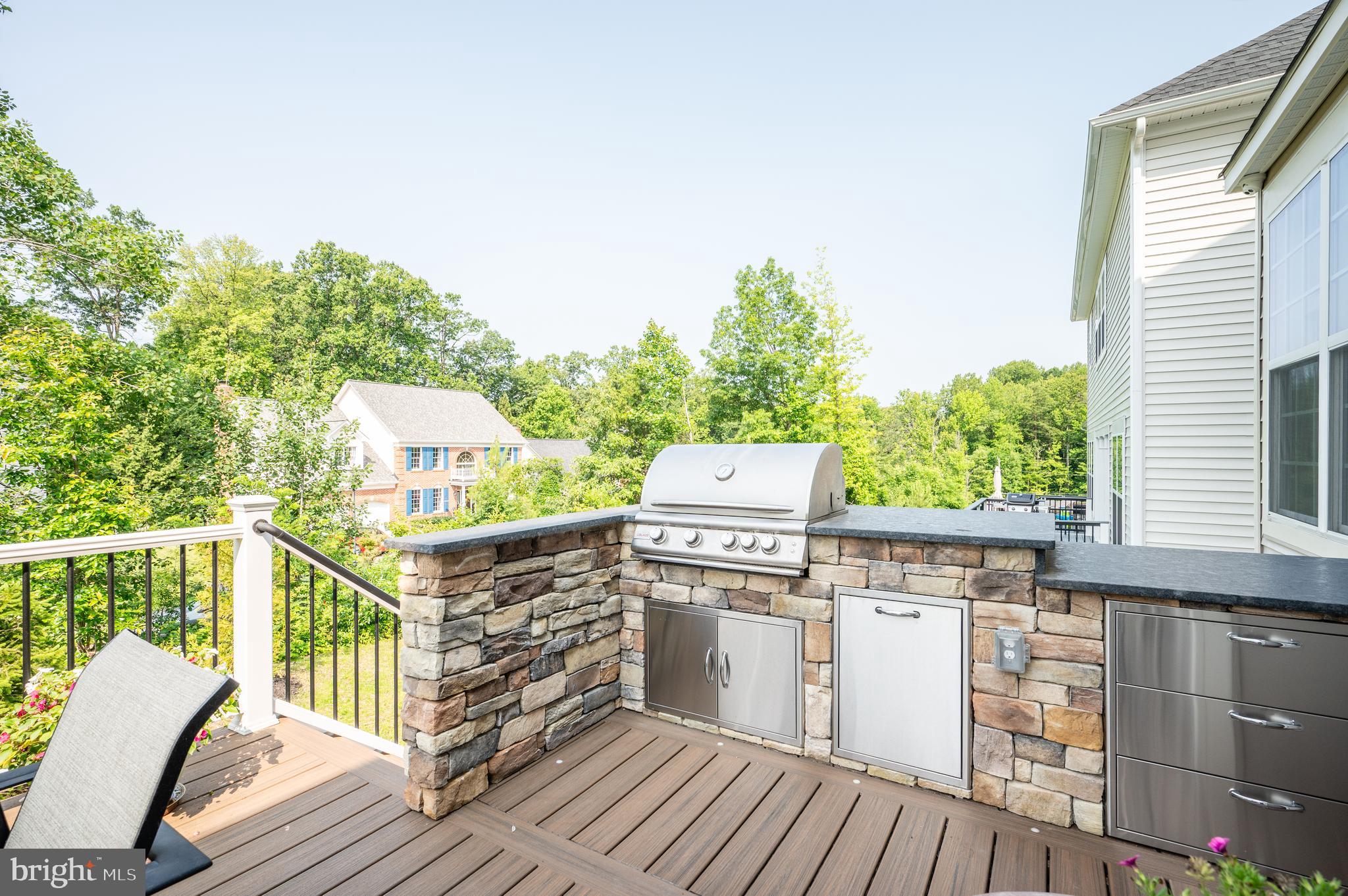 6233 McConnell Lane Springfield, VA 22152 - Photo 7 of 58 a view of a deck with wooden floor and fence