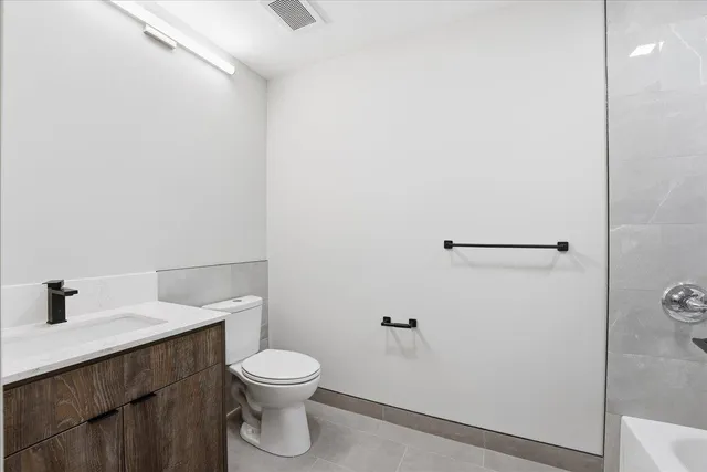 a kitchen with stainless steel appliances a sink and a large window
