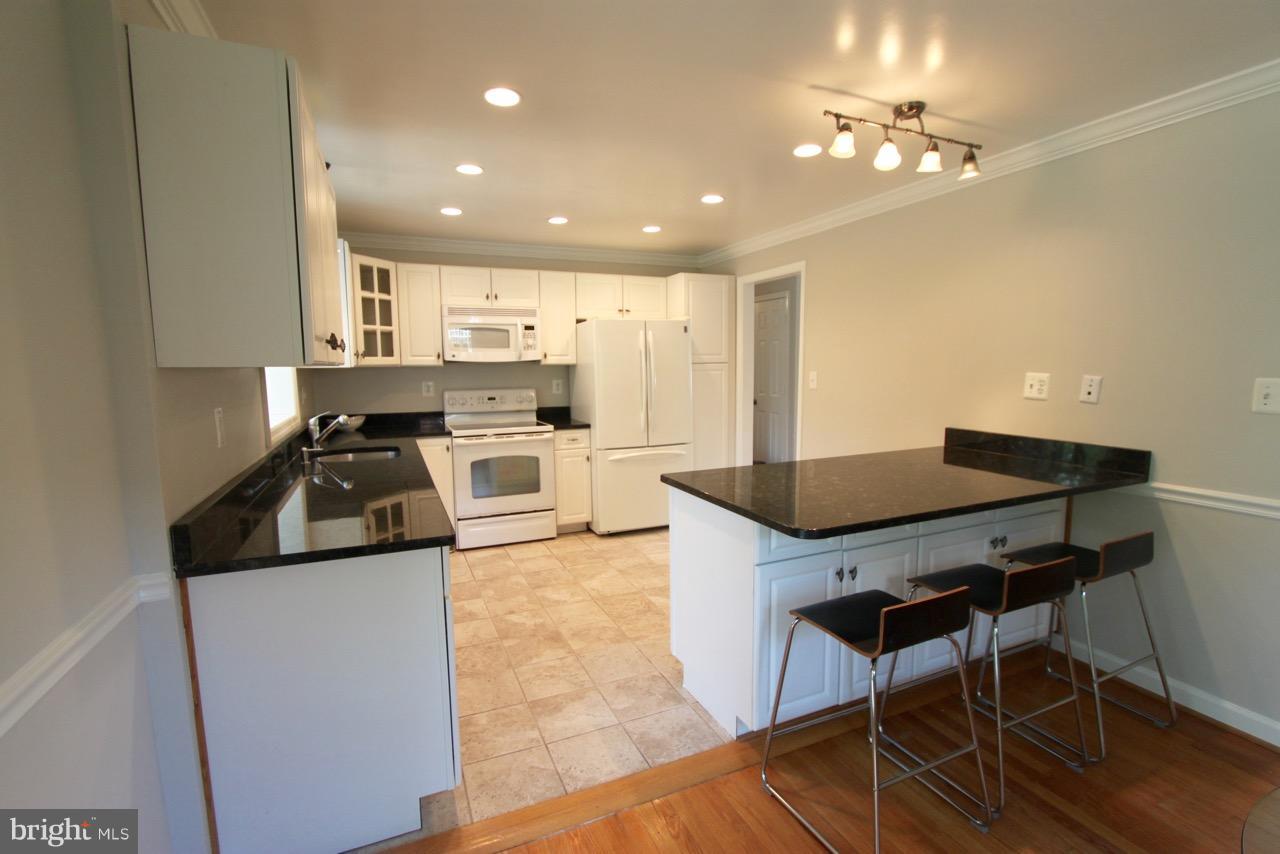 1009 Collingwood Road Alexandria, VA 22308 - Photo 7 of 30 Large kitchen with counter seating.