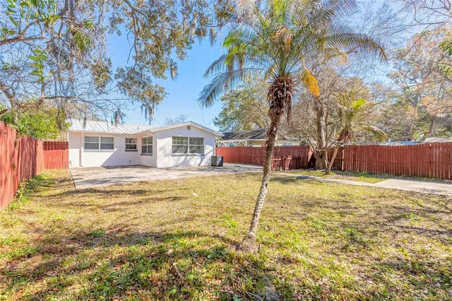 a view of a house with snow on the road