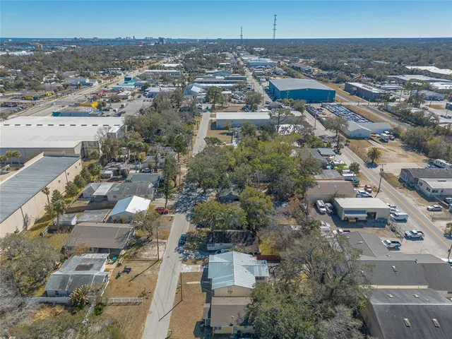 an aerial view of a house with a yard