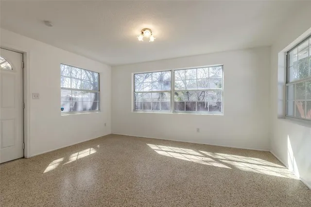 a view of empty room with windows