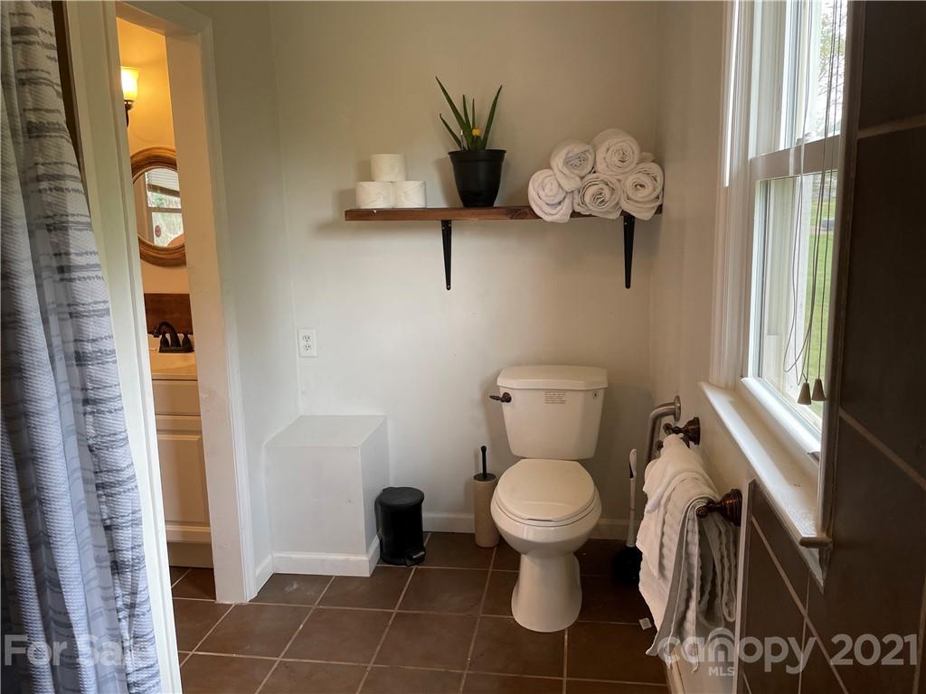 622 Loray Farm Road Dallas, NC 28034 - Photo 13 of 15 a bathroom with a toilet sink and mirror