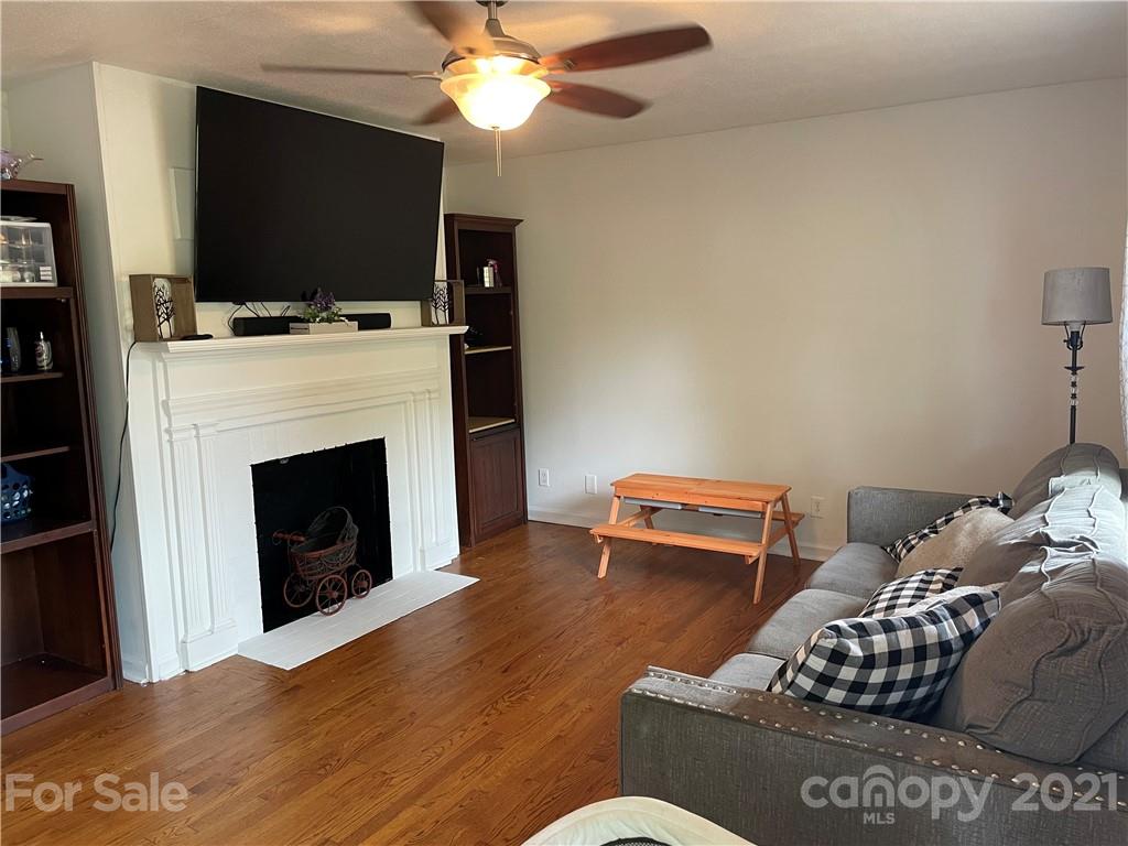 622 Loray Farm Road Dallas, NC 28034 - Photo 6 of 15 a living room with furniture and a flat screen tv