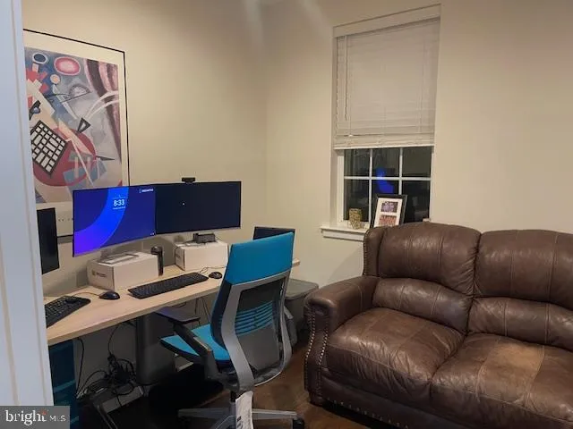 a work room with furniture and a window