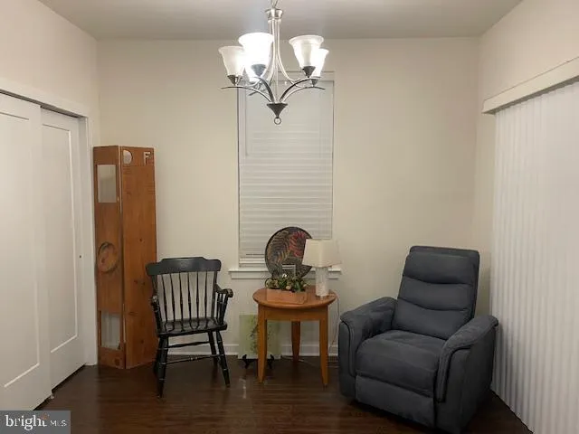 a view of a livingroom with furniture and wooden floor