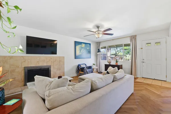 a bedroom with furniture and a flat screen tv