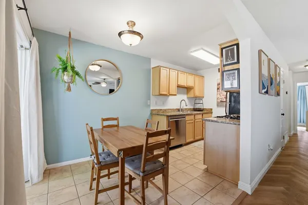a kitchen with a table and chairs