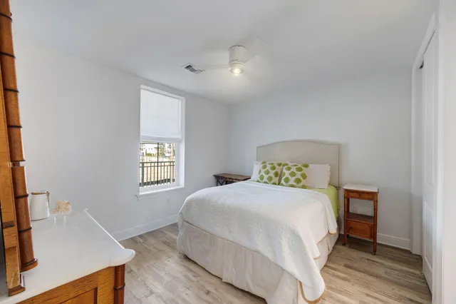 a bedroom with a bed and a dresser