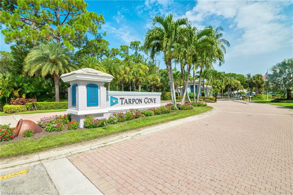 867 Carrick Bend Circle, Unit 2103 Naples, FL 34110 - Photo 30 of 32 a view of a house with a yard and potted plants