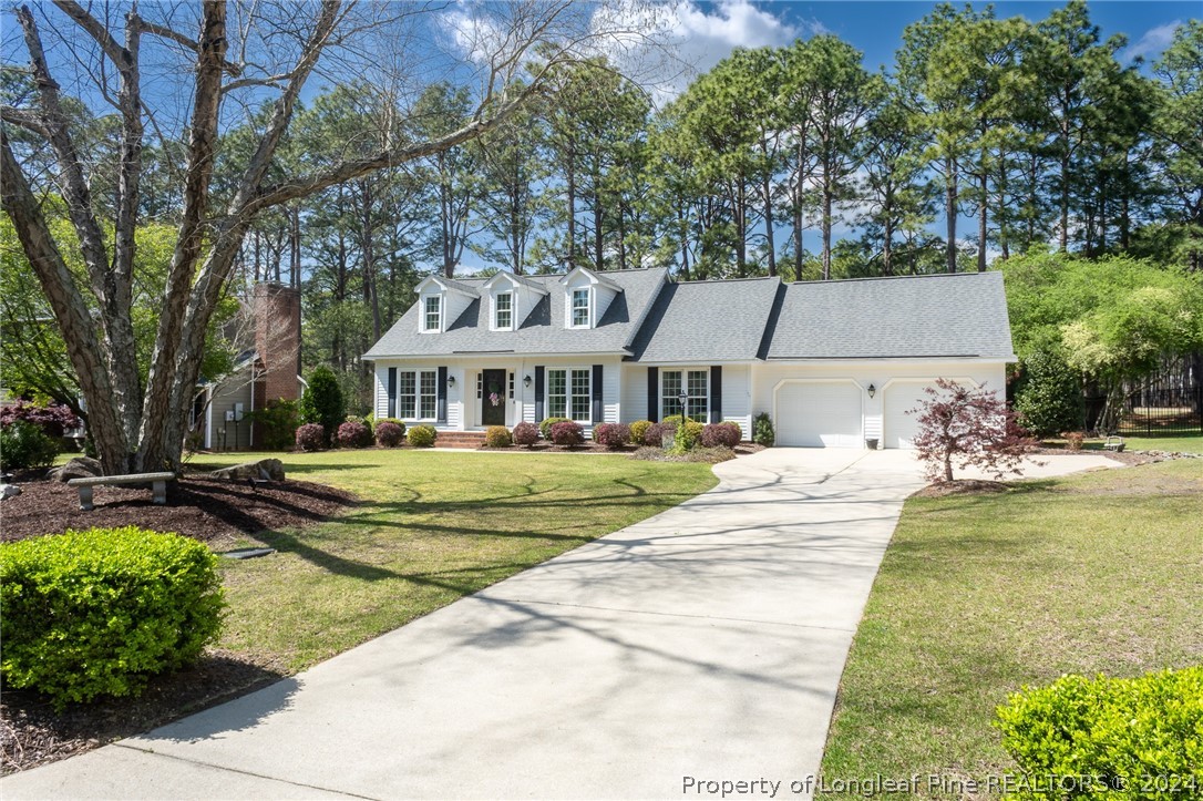 6860 Uppingham Road Fayetteville, NC 28306 - Photo 2 of 44 a view of house with outdoor space and swimming pool