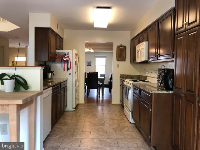 a view of kitchen with furniture and window