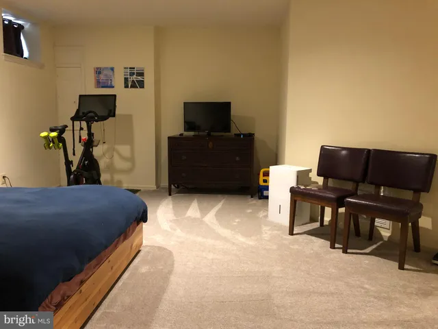 a view of an empty room and a window