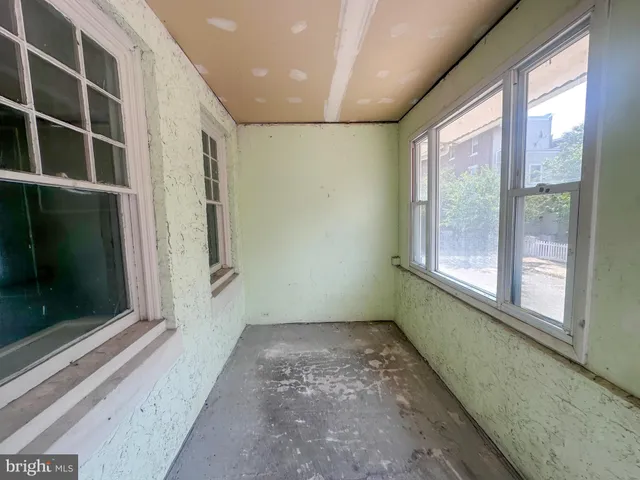 a view of empty room with windows