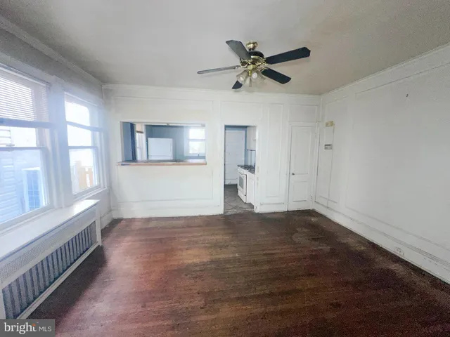 a kitchen with a stove sink and cabinets