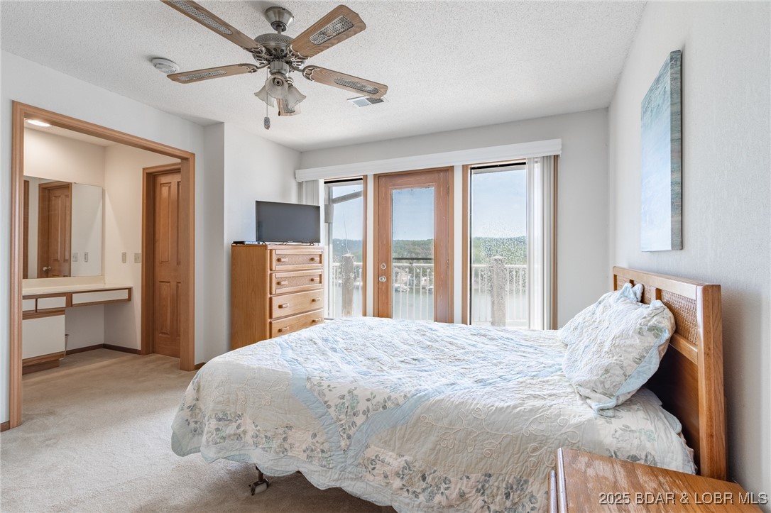 210 Bluff Boulevard, Unit 4B Camdenton, MO 65020 - Photo 13 of 69 Primary with Bathroom/ Walk out Deck