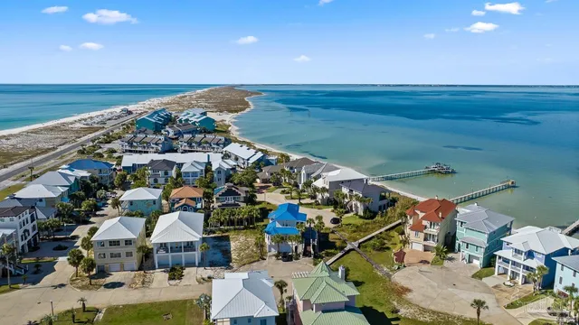 a view of a dining room with furniture wooden floor and chandelier