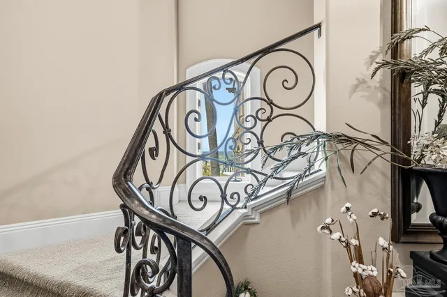 a dining hall with stainless steel appliances a dining table and chairs with wooden floor