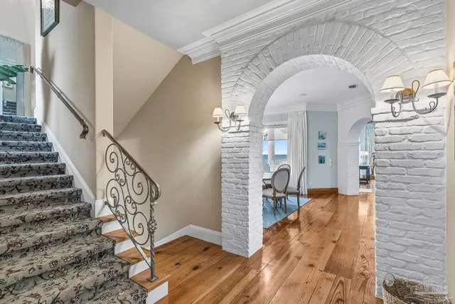 a kitchen with stainless steel appliances granite countertop a sink a stove counter space and cabinets