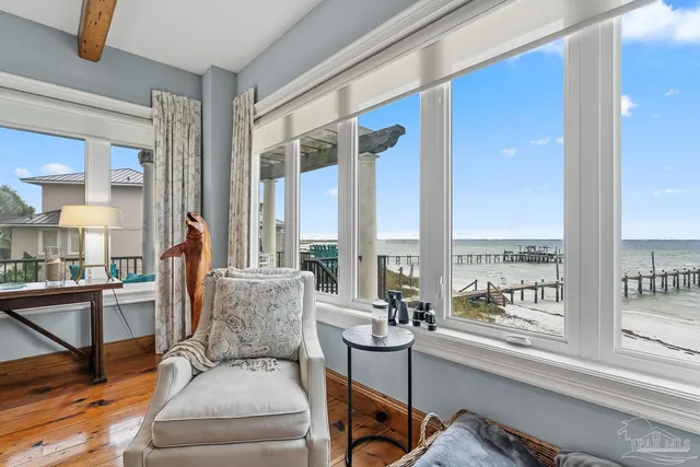 a bathroom with a sink vanity granite tub and a mirror