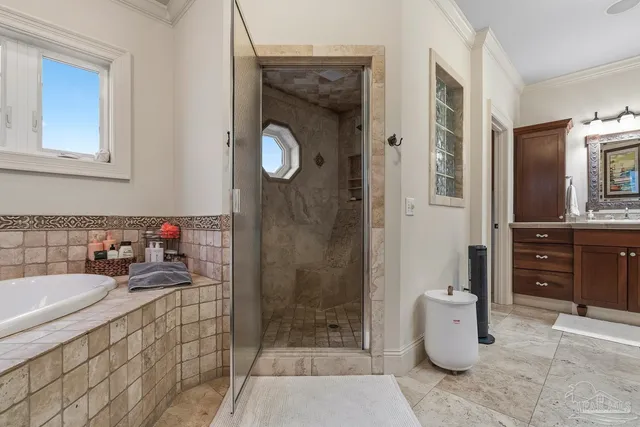 a view of a bedroom with wooden floor and windows