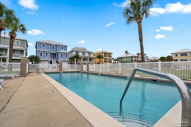 a view of a swimming pool with a lake view