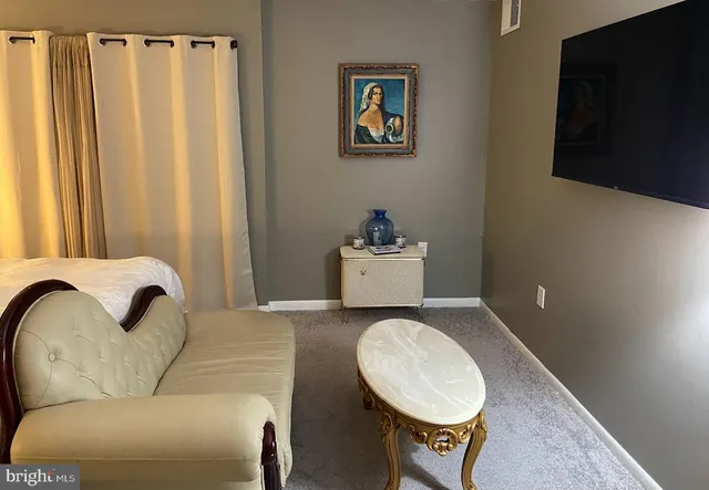 a bathroom with a sink mirror and toilet