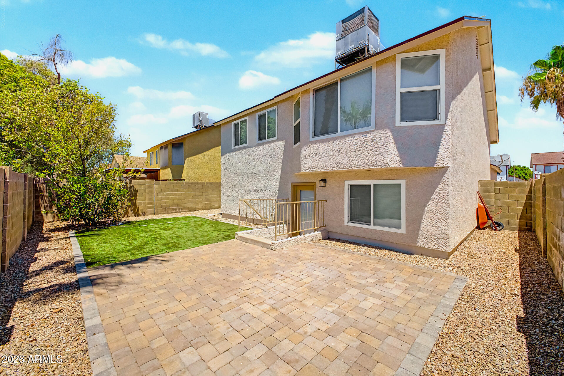 3134 East McKellips Road, Unit 221 Mesa, AZ 85213 - Photo 27 of 29 a front view of a house with a yard and garage