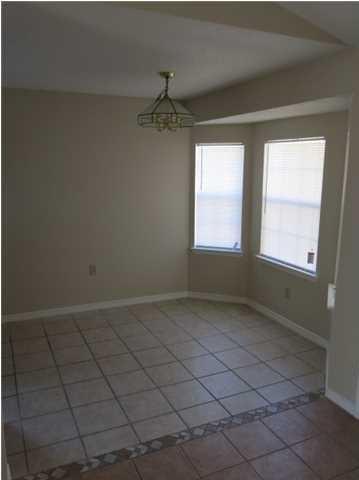 41 3rd Avenue Shalimar, FL 32579 - Photo 4 of 9 a view of an empty room and a window