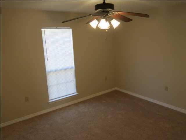 41 3rd Avenue Shalimar, FL 32579 - Photo 5 of 9 an empty room with a empty space and a window