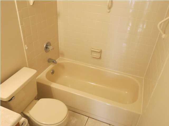 41 3rd Avenue Shalimar, FL 32579 - Photo 6 of 9 a bathroom with a toilet and bathtub