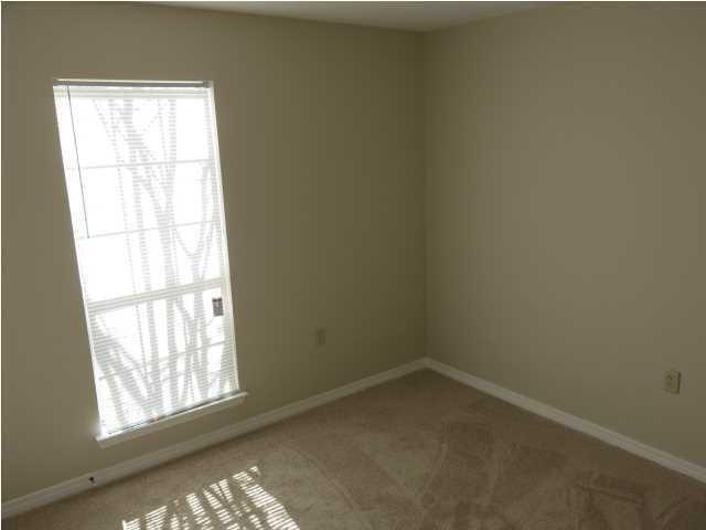 41 3rd Avenue Shalimar, FL 32579 - Photo 8 of 9 an empty room with a window