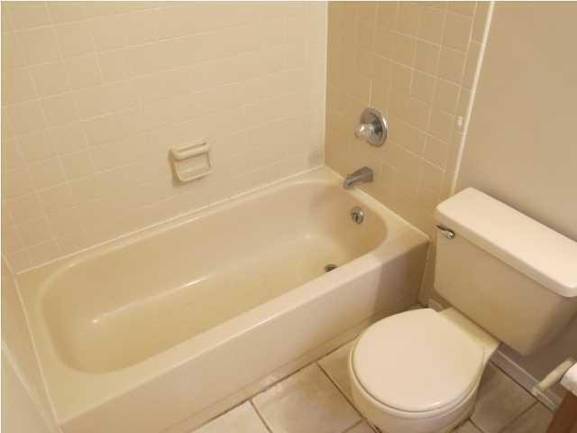 41 3rd Avenue Shalimar, FL 32579 - Photo 9 of 9 a white toilet sitting next to a bath tub