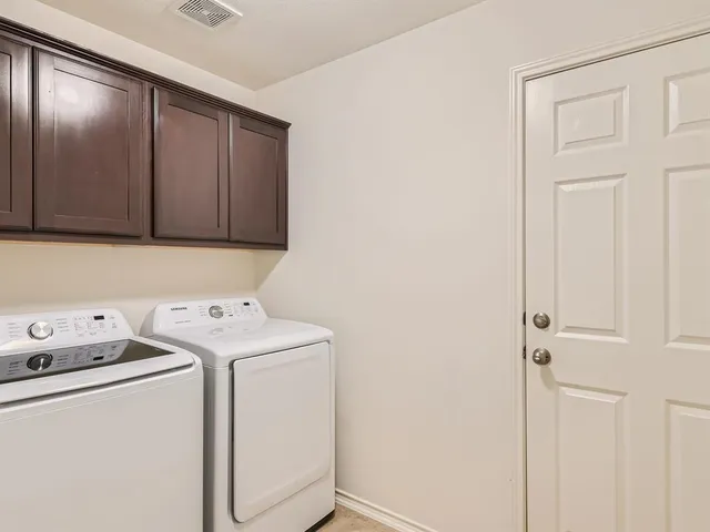 a view of a livingroom with furniture and a ceiling fan