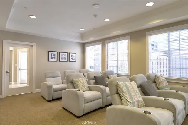 a front view of a house with outdoor seating and windows