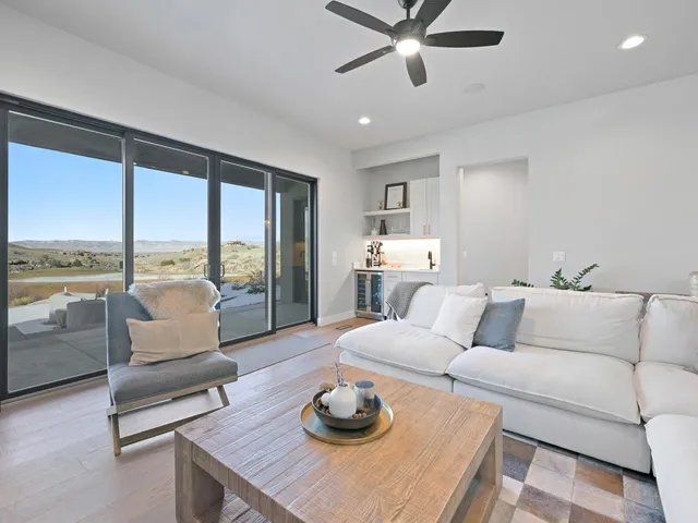 a view of cabinets a sink and dishwasher with wooden floor