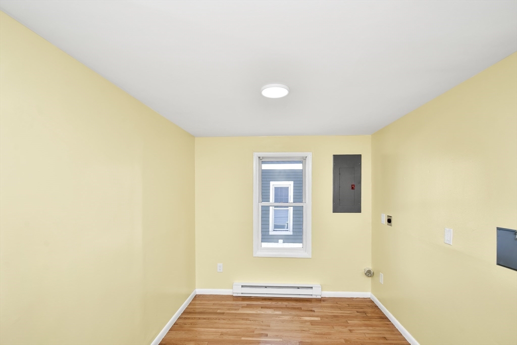 11 Greendale Road, Unit 2 Boston, MA 02126 - Photo 17 of 25 a view of an empty room with a window