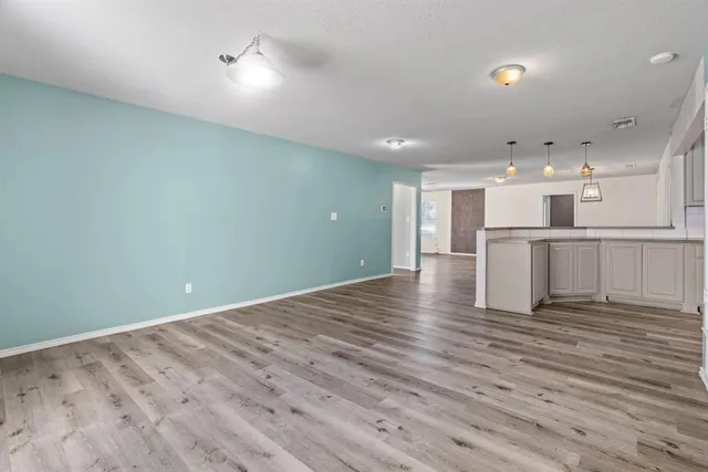 a view of kitchen with wooden floor