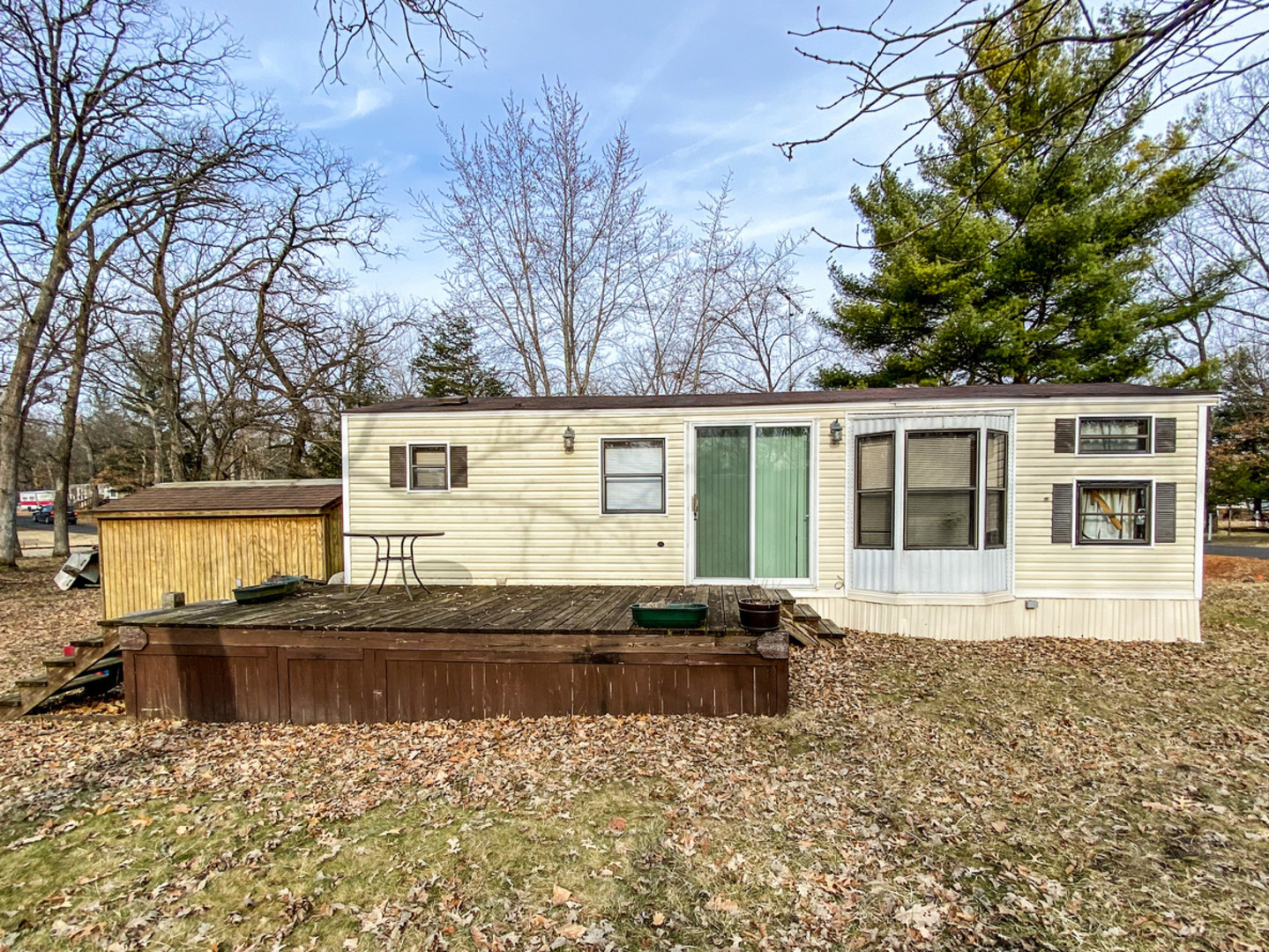 2-110 Woodhaven Lakes Sublette, IL 61367 - Photo 1 of 16 a front view of a house with a yard