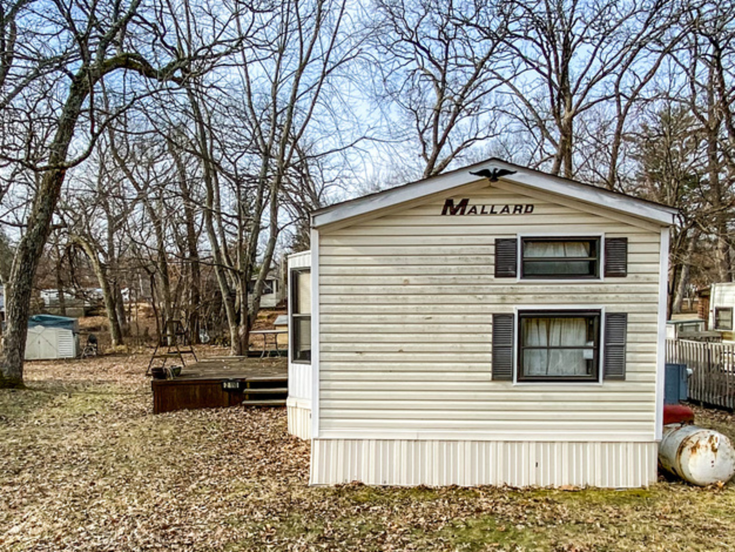 2-110 Woodhaven Lakes Sublette, IL 61367 - Photo 3 of 16 a front view of a house with a yard