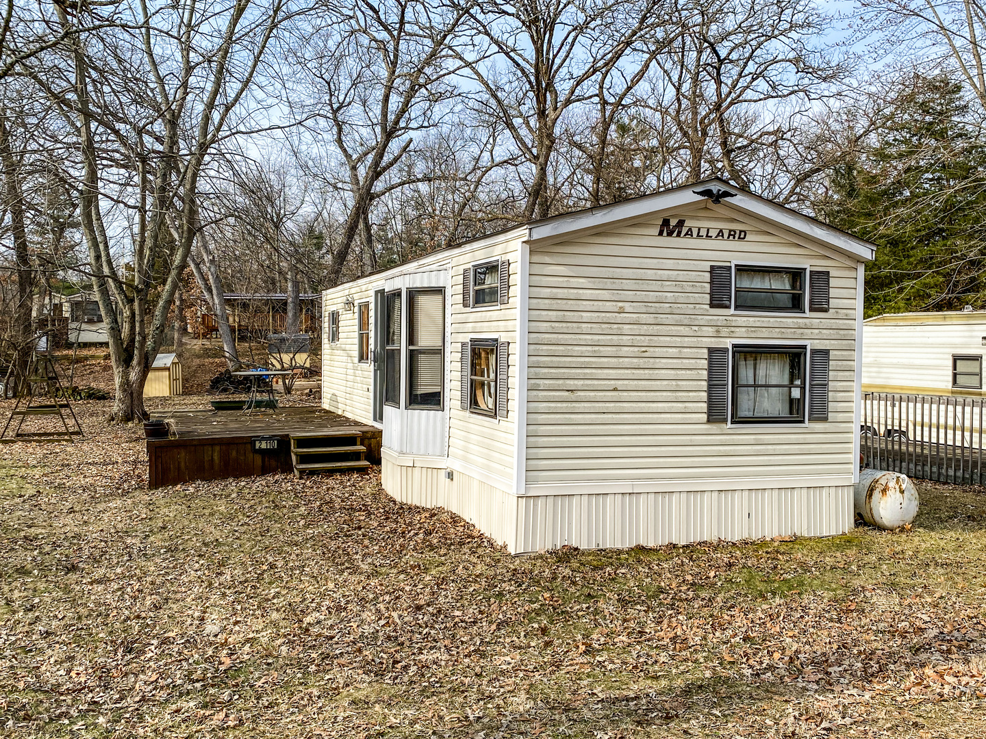 2-110 Woodhaven Lakes Sublette, IL 61367 - Photo 4 of 16 a front view of a house with a yard