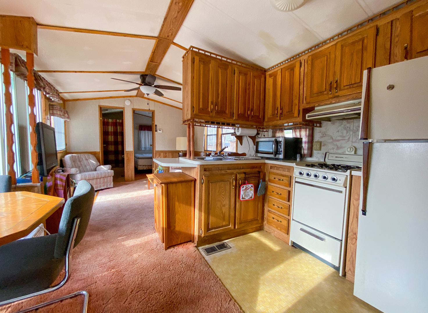 2-110 Woodhaven Lakes Sublette, IL 61367 - Photo 5 of 16 a kitchen with stainless steel appliances granite countertop a stove a sink and a refrigerator