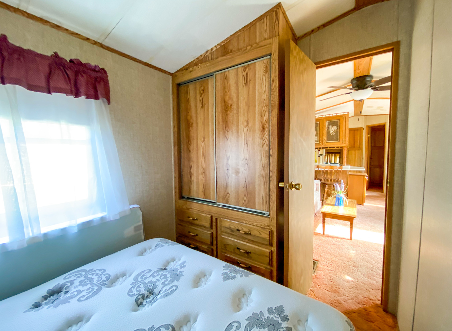 2-110 Woodhaven Lakes Sublette, IL 61367 - Photo 8 of 16 a bedroom with a bed and wooden floor