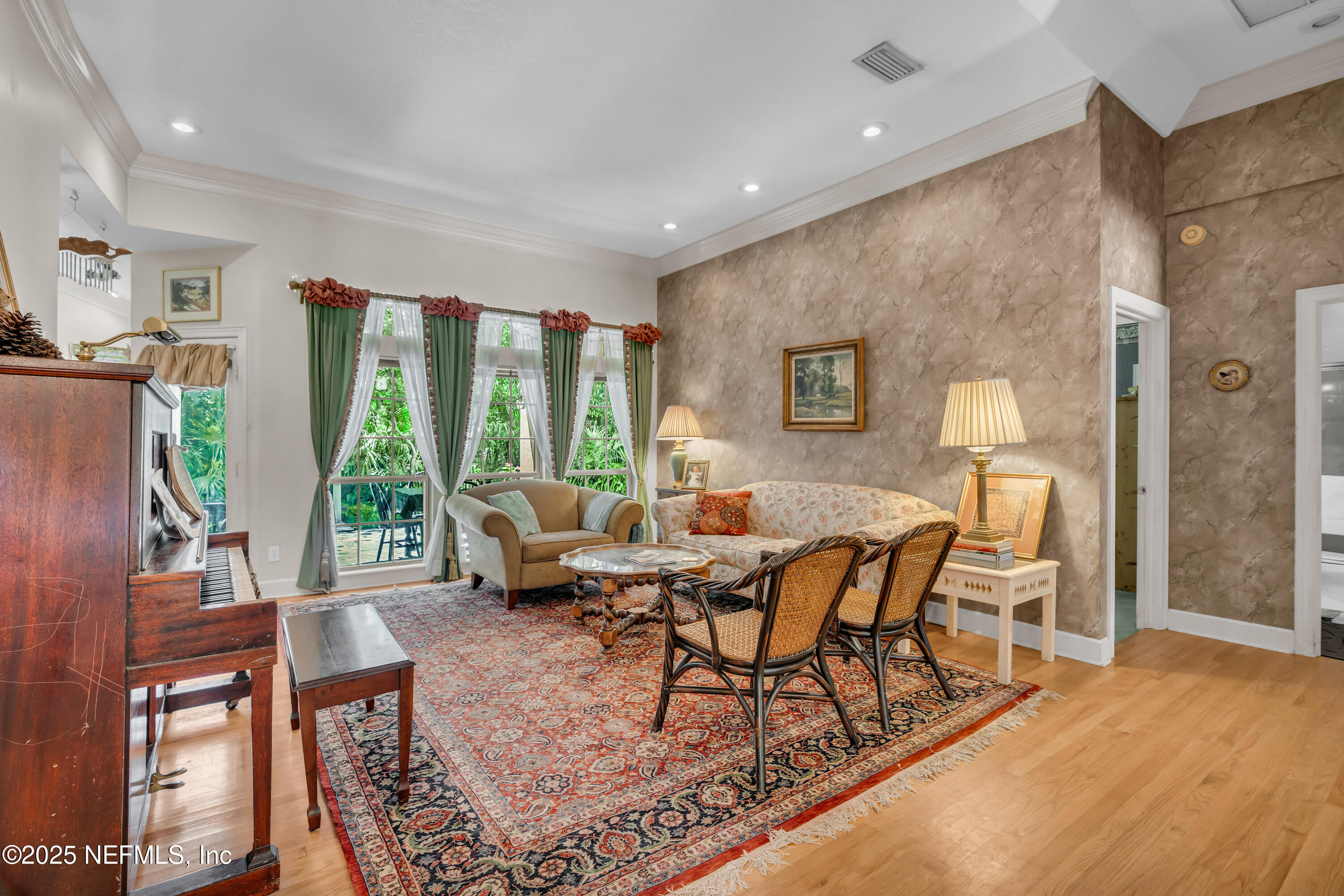 244 Bluebird Lane St. Augustine Beach, FL 32080 - Photo 14 of 66 a living room with furniture and large windows