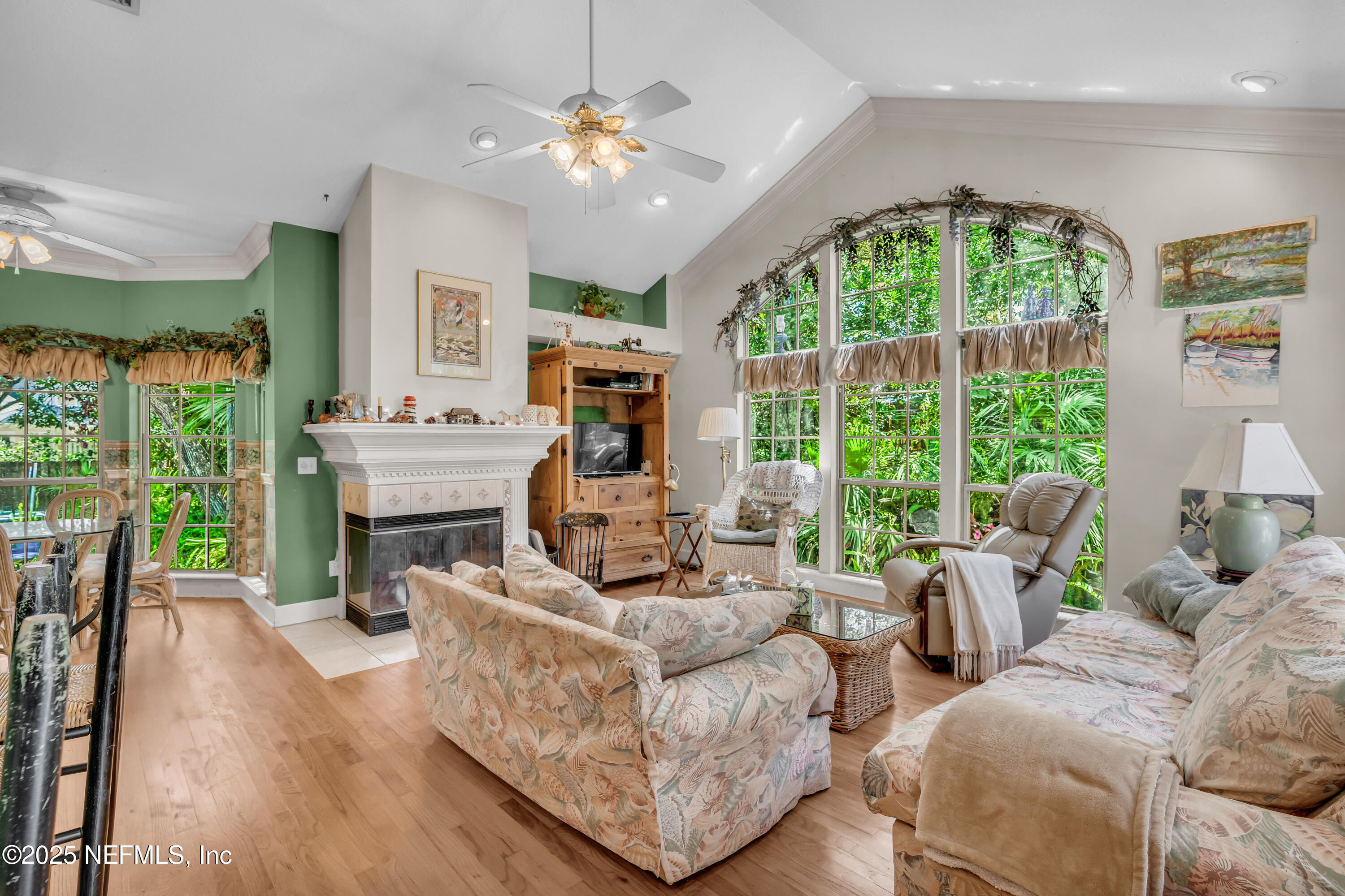 244 Bluebird Lane St. Augustine Beach, FL 32080 - Photo 21 of 66 a living room with furniture fireplace and a large window
