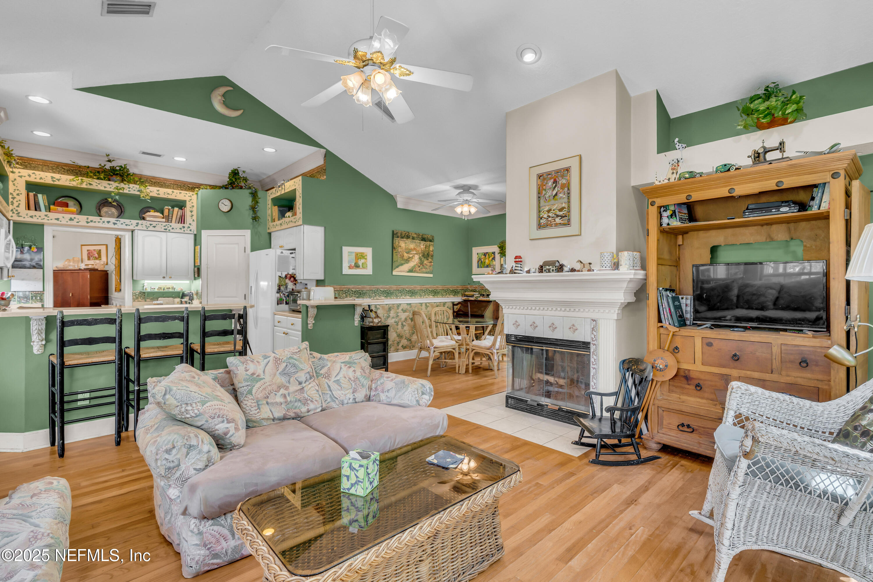 244 Bluebird Lane St. Augustine Beach, FL 32080 - Photo 22 of 66 a living room with furniture fireplace and flat screen tv