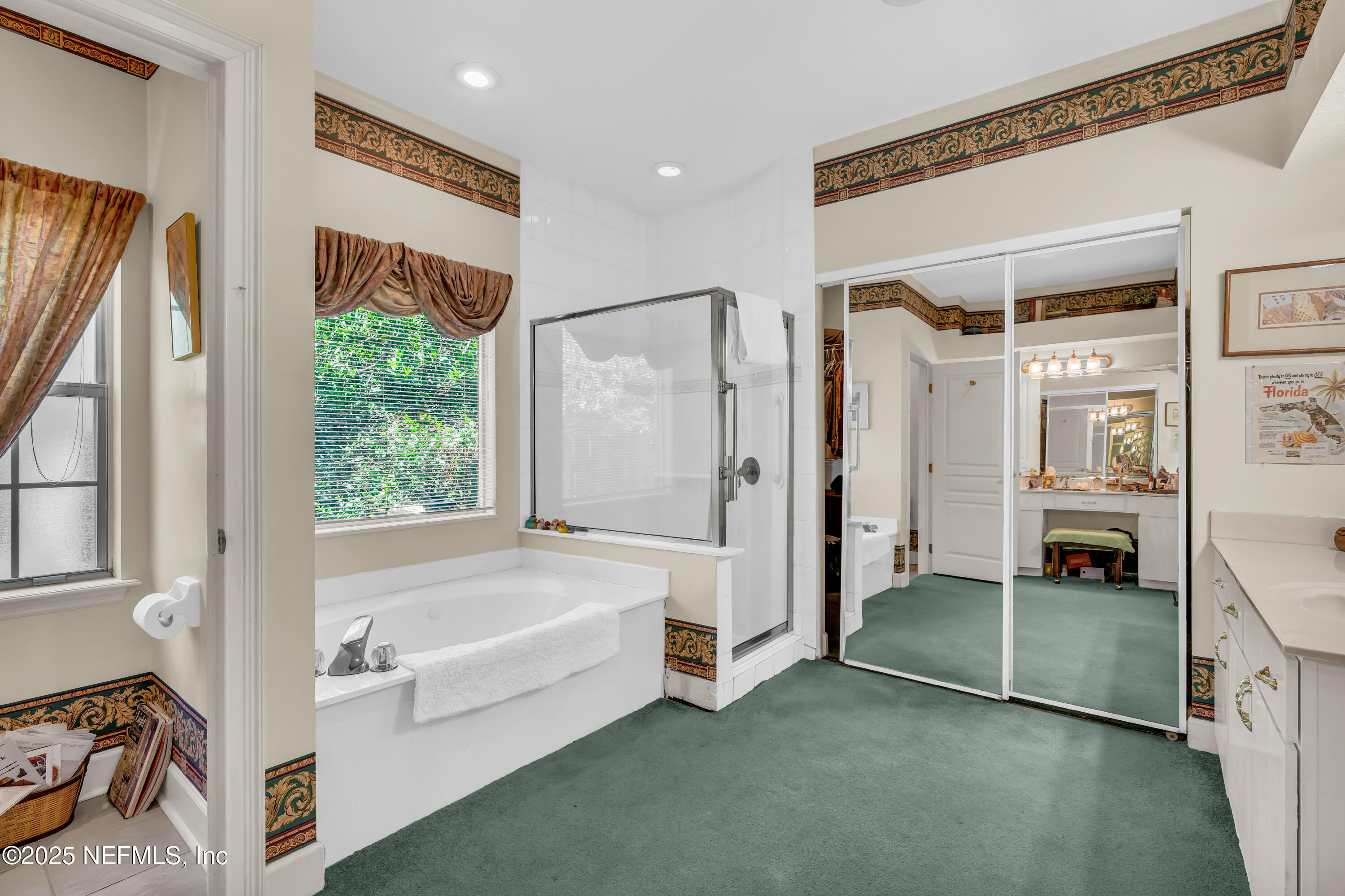 244 Bluebird Lane St. Augustine Beach, FL 32080 - Photo 29 of 66 a spacious bathroom with a tub and a shower