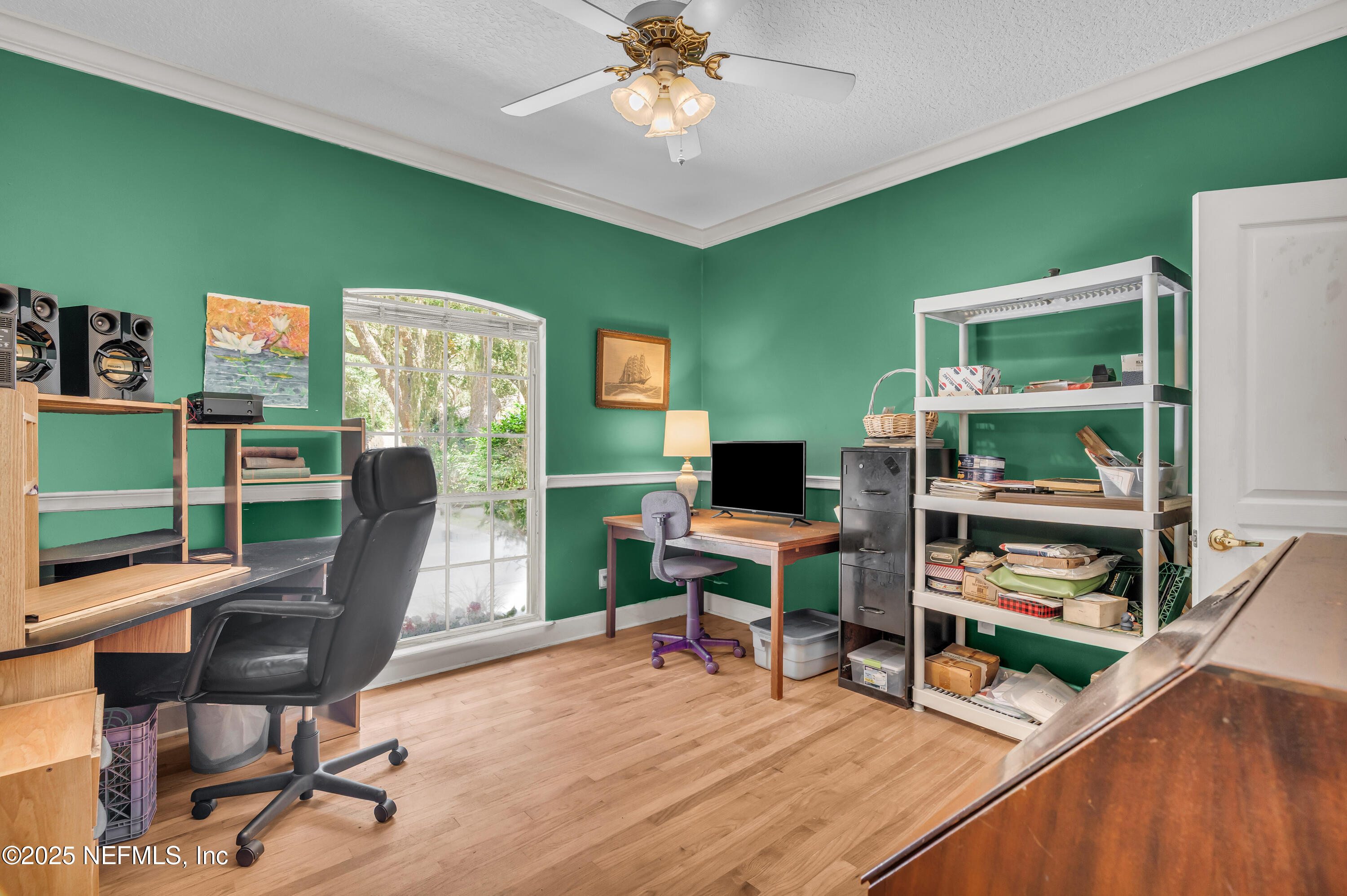 244 Bluebird Lane St. Augustine Beach, FL 32080 - Photo 33 of 66 a work room with furniture and a wooden floor