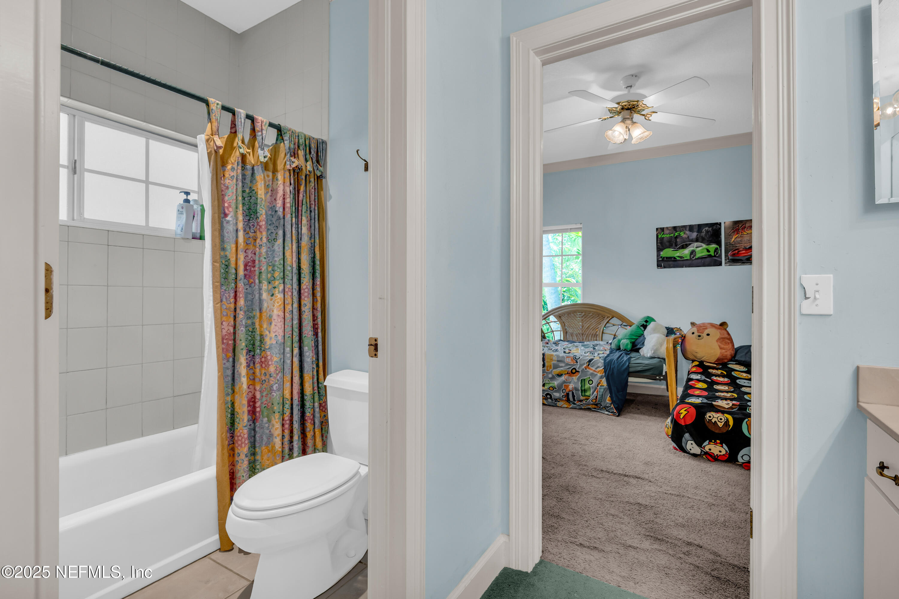 244 Bluebird Lane St. Augustine Beach, FL 32080 - Photo 41 of 66 a view of bathroom with a tub shower and a sink